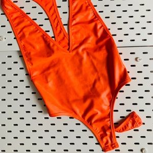Neon orange racerback bodysuit